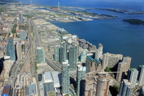 Construction of Pinnacle One Yonge in Toronto seen from above, showing cranes and building framework