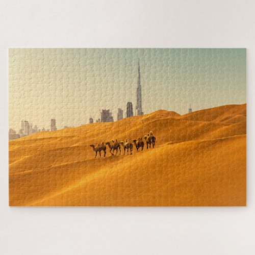 Dubai jigsaw puzzle featuring dunes and camels in the foreground, while the Burj Khalifa and the Dubai skyline towers in the background