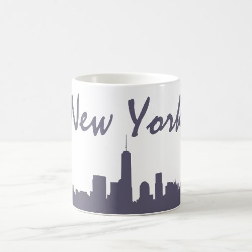 This coffee mug features "New York" in bold alongside a shadow of the lower manhattan skyline