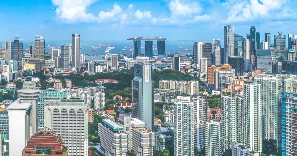 Skyscraper Stories Singapore Skyline on a beautiful day featuring Marina Bay Sands